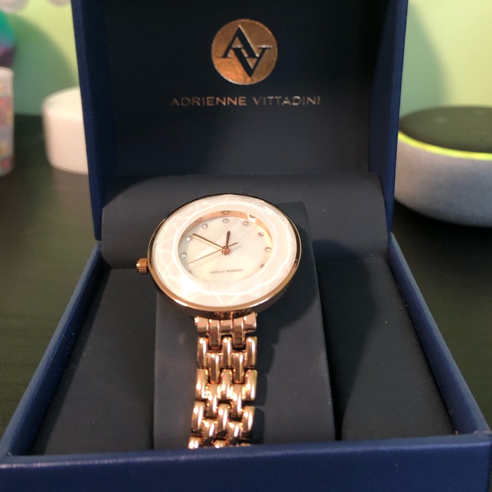 Watch with gold band and white marble face